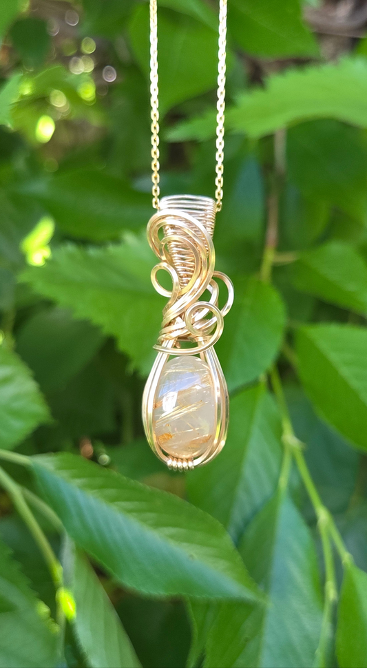 Rutilated quartz and Gold